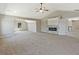 Large bedroom showcases an elegant stone fireplace, recessed lighting and neutral carpeting at 125 Leverett Ct, Fayetteville, GA 30215