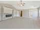 Neutral bedroom with stone fireplace, recessed lighting, and access to multiple rooms at 125 Leverett Ct, Fayetteville, GA 30215