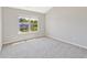 Bedroom featuring neutral carpet, a large window, and light-colored walls at 125 Leverett Ct, Fayetteville, GA 30215