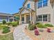 Charming home entrance with stone walkway and well-manicured landscaping at 125 Leverett Ct, Fayetteville, GA 30215