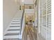 Grand foyer with staircase and hardwood floors with an open view of the living room at 125 Leverett Ct, Fayetteville, GA 30215