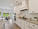 Well-equipped kitchen featuring stainless steel appliances, granite countertops, and a bright breakfast nook at 125 Leverett Ct, Fayetteville, GA 30215