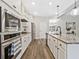 Bright, modern kitchen with stainless appliances, granite counters, and open layout flowing to breakfast nook at 125 Leverett Ct, Fayetteville, GA 30215