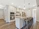 Modern kitchen features stainless steel appliances, an island with seating, and beautiful countertops at 125 Leverett Ct, Fayetteville, GA 30215