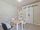 Bright, carpeted office with modern desk, barn door feature, and neutral color palette creating a workspace at 125 Leverett Ct, Fayetteville, GA 30215