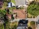 Aerial view of home with a brown roof, driveway, lush greenery, and surrounding neighborhood at 1285 Oakdale Ne Rd, Atlanta, GA 30307