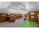 Finished basement with gym equipment, wood paneling and ample lighting perfect for recreation and exercise at 1285 Oakdale Ne Rd, Atlanta, GA 30307