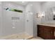 Modern bathroom featuring a glass-enclosed shower with a tiled floor, white walls, and a vanity at 1285 Oakdale Ne Rd, Atlanta, GA 30307