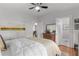 Bright bedroom boasts light walls, and a ceiling fan that complements the hardwood floors at 1285 Oakdale Ne Rd, Atlanta, GA 30307