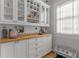 Butler's pantry with storage, wine racks, pet bowls, natural light, and butcher block countertop at 1285 Oakdale Ne Rd, Atlanta, GA 30307