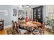 Light-filled dining room featuring hardwood floors, a stylish light fixture, and a built-in display cabinet at 1285 Oakdale Ne Rd, Atlanta, GA 30307