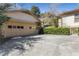 Spacious driveway leading to a two-car garage and a home with lush landscaping at 1285 Oakdale Ne Rd, Atlanta, GA 30307