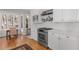 Updated kitchen with stainless steel appliances, white cabinets, eat-in breakfast area, and hardwood floors at 1285 Oakdale Ne Rd, Atlanta, GA 30307