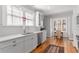 Bright kitchen featuring white cabinets, stainless steel appliances, tile backsplash, and breakfast nook area at 1285 Oakdale Ne Rd, Atlanta, GA 30307