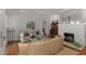 Well-lit living room with hardwood floors, fireplace, and comfortable seating at 1285 Oakdale Ne Rd, Atlanta, GA 30307