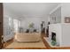 Cozy living room with hardwood floors, a white fireplace, and bright natural light at 1285 Oakdale Ne Rd, Atlanta, GA 30307