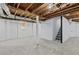 Unfinished basement provides ample space with stairs for easy access to other floors at 2241 Glendale Dr, Decatur, GA 30032