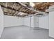 Spacious unfinished basement with painted walls, open ceiling, and concrete floor at 2241 Glendale Dr, Decatur, GA 30032