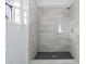Tiled shower features modern fixtures, enhancing the bathroom's contemporary appeal at 2241 Glendale Dr, Decatur, GA 30032