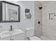 Modern bathroom with a sleek vanity, matte black fixtures, and tiled shower at 2241 Glendale Dr, Decatur, GA 30032