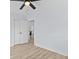 Bright bedroom featuring light wood floors, a closet, and a ceiling fan at 2241 Glendale Dr, Decatur, GA 30032