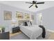 Well-lit bedroom featuring a comfortable bed, modern decor, and a ceiling fan at 2241 Glendale Dr, Decatur, GA 30032