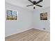 Sun-drenched bedroom with wood flooring, light gray walls, and a ceiling fan at 2241 Glendale Dr, Decatur, GA 30032