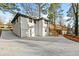 Exterior shot of house with brick siding, driveway and back deck at 2241 Glendale Dr, Decatur, GA 30032