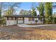 Beautifully renovated single-story home featuring modern paint, dark trim, and a concrete walkway at 2241 Glendale Dr, Decatur, GA 30032
