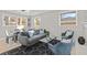 Bright living room with modern furnishings, neutral paint, and an open floor plan to the dining area at 2241 Glendale Dr, Decatur, GA 30032