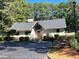Charming single-story home featuring stone accents, a well-manicured yard, and a secure fence at 25 Fair Haven Way, Smyrna, GA 30080