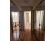 Mirrored closet doors along the hallway provide ample storage, adjacent to bathrooms at 25 Fair Haven Way, Smyrna, GA 30080
