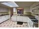 Bright kitchen featuring white cabinets, laminate countertops, and tile flooring at 25 Fair Haven Way, Smyrna, GA 30080