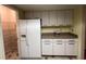 The kitchen offers white cabinets and a spacious pantry with tiled floors at 25 Fair Haven Way, Smyrna, GA 30080