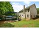 Backyard view featuring a swimming pool, patio, and a wooden deck covered by a pergola at 3131 Leyland Ct, Decatur, GA 30034