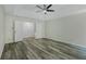 Spacious bedroom featuring hardwood-style flooring and a trey ceiling with ceiling fan at 3131 Leyland Ct, Decatur, GA 30034
