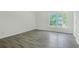 Bedroom with modern gray flooring and a large window view at 3131 Leyland Ct, Decatur, GA 30034