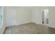 Bedroom with light walls, white doors, and modern flooring at 3131 Leyland Ct, Decatur, GA 30034
