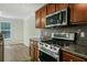 Well-equipped kitchen boasting stainless steel appliances, and wooden cabinets at 3131 Leyland Ct, Decatur, GA 30034