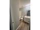 Bathroom with a vanity, framed mirror, and a toilet at 930 Parkway Rd, Union City, GA 30291