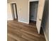 Bedroom features neutral walls, wood-look flooring, and an open closet at 930 Parkway Rd, Union City, GA 30291