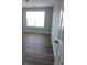 Bright bedroom featuring hard wood flooring, a neutral paint color and large windows at 930 Parkway Rd, Union City, GA 30291