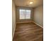 Bedroom featuring natural light and wood-look flooring at 930 Parkway Rd, Union City, GA 30291