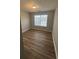 Bedroom featuring natural light and wood-look flooring at 930 Parkway Rd, Union City, GA 30291