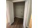 Walk-in closet with wood-look flooring and access for a washer and dryer at 930 Parkway Rd, Union City, GA 30291