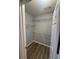 Walk-in closet features wire shelving and wood-look flooring at 930 Parkway Rd, Union City, GA 30291
