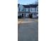 Exterior shot of a two story townhome featuring a driveway and landscaping at 930 Parkway Rd, Union City, GA 30291