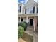 Traditional-style home featuring vinyl siding and manicured shrubbery around the front entrance at 930 Parkway Rd, Union City, GA 30291
