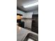 A kitchen featuring stainless steel appliances, white cabinets, and granite countertops at 930 Parkway Rd, Union City, GA 30291