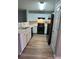 Well-equipped kitchen featuring black appliances and bright white cabinets at 930 Parkway Rd, Union City, GA 30291